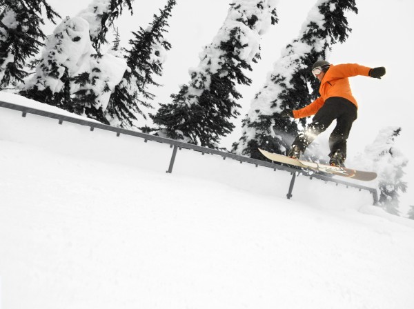 Person Snowboarding On A Railing by PacificStock