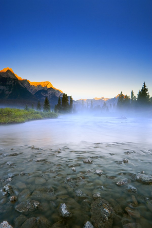 Sunrise And Early Morning Mist On Mountain River by PacificStock