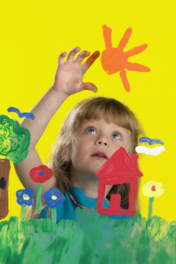 Girl Painting On Glass by PacificStock