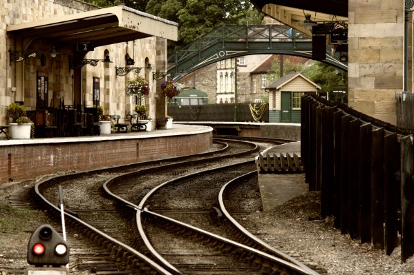 An Old-Fashioned Train Station And Tracks by PacificStock