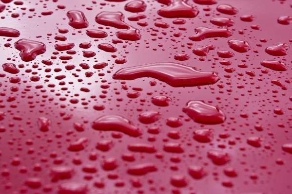 Liquid Drops On Red Surface Print