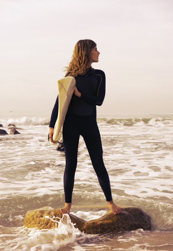 Young Woman With Her Surfboard; Tarifa, Cadiz, Andalusia, Spain by PacificStock