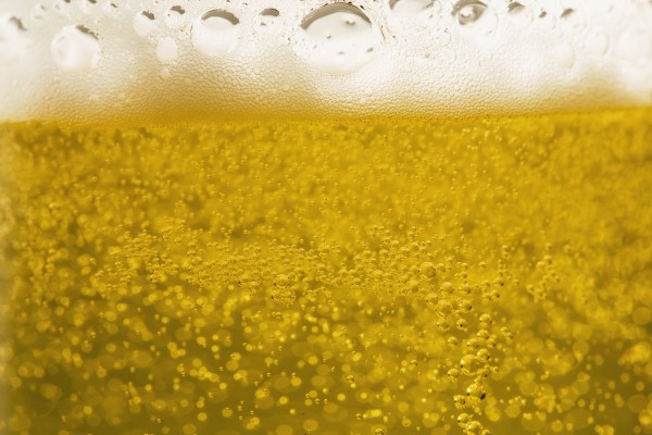 Close-Up Of Beer Bubbles And Foam In A Glass by PacificStock