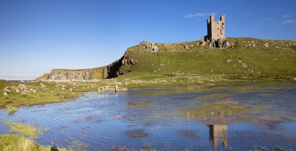 Dunstanburgh Castle; Northumberland, England by PacificStock