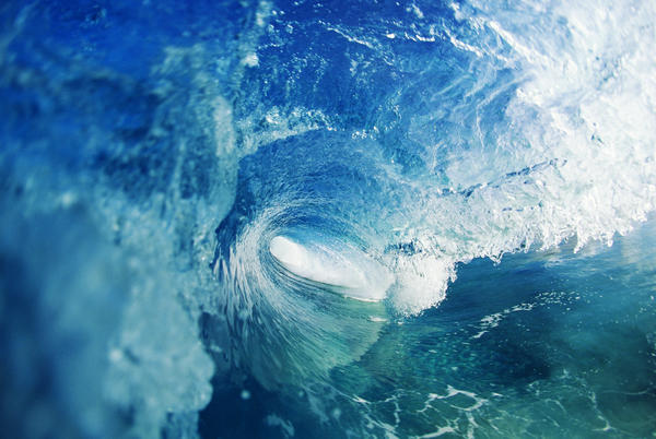View From Inside Tube Of Inside Of Wave, Circular Pattern, Sun Reflections In The Blue Water by PacificStock