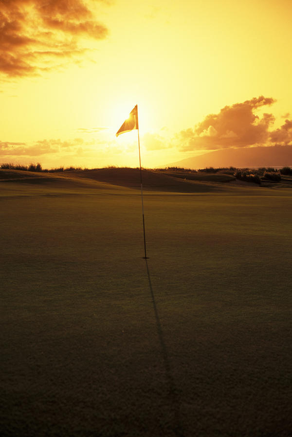 Hawaii, Maui, Kapalua Golf Club Plantation Course, 4Th Hole Flag At Sunset by PacificStock