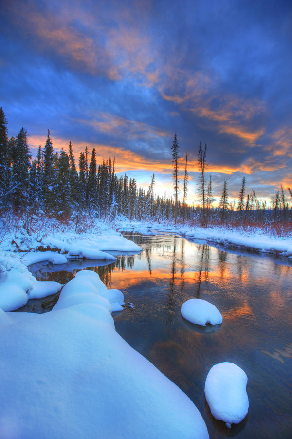 Orange Clouds At Sunset And Little Hazel Creek, Yukon by PacificStock