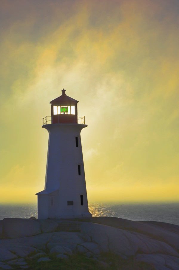 Sunset Over Peggy's Cove Lighthouse. by PacificStock