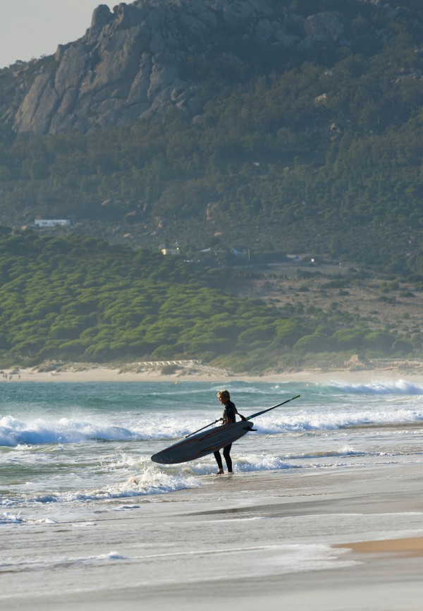 Windsurfer Standing On The Beach; Tarifa, Cadiz, Andalusia, Spain by PacificStock