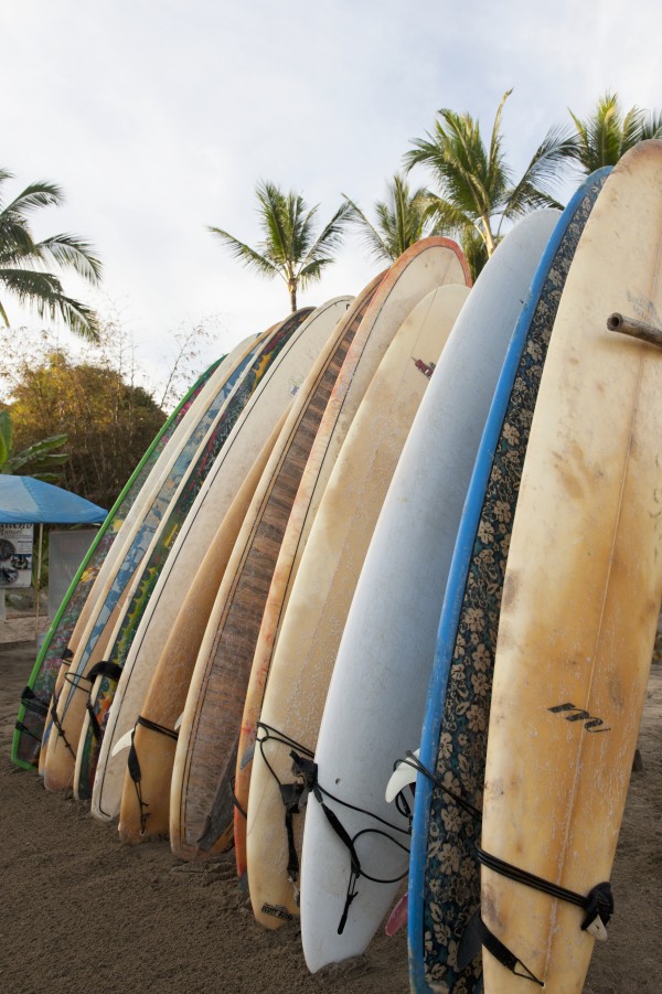 Surfboards Standing Up Against A Rack On The Beach; Sayulita, Mexico by PacificStock