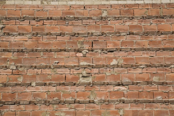 Close-Up Of A Brick Wall With Exposed Cement Mortar Joints; Laval, Quebec, Canada by PacificStock