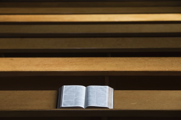 A bible open on a wooden bench;Northumberland england by PacificStock