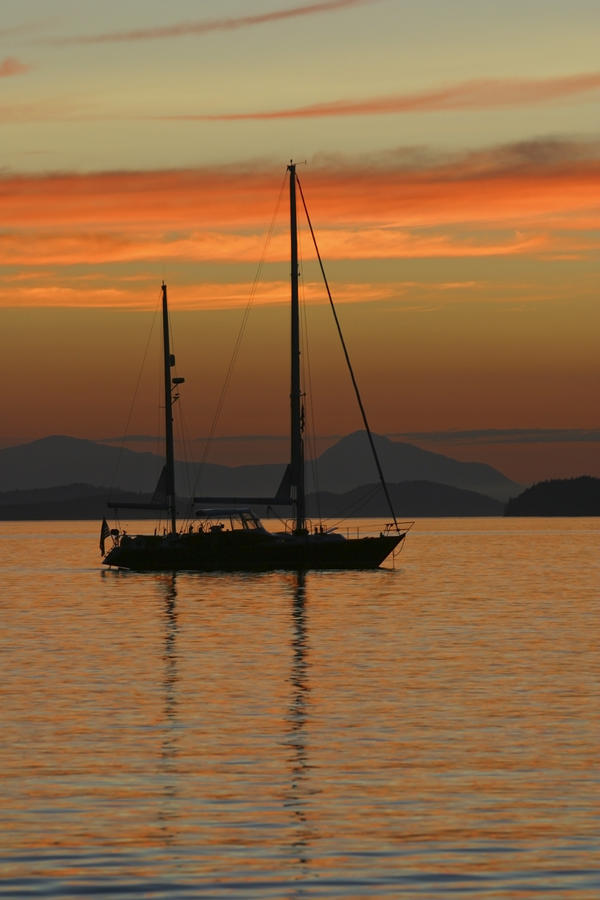 A Sailboat Is Anchored For The Night In The Gulf Islands Of British Columbia, Sunset, Canada, Summer by PacificStock