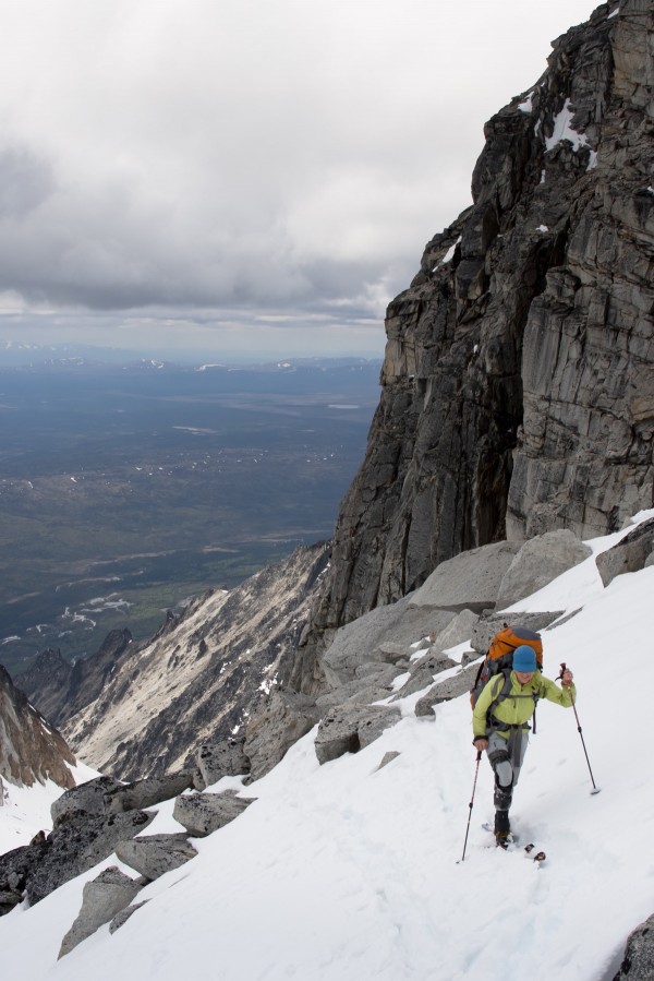 View Of Female Skier By Granite Cliffs Above The Swift River At The South End Of The Revelation Mountains, Summer In Southcentral Alaska by PacificStock