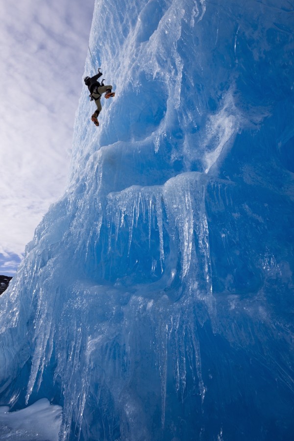 An Ice Climber Ascends The Face Of A Large Iceberg Frozen Into Mendenhall Lake, Juneau, Southeast Alaska, Winter by PacificStock