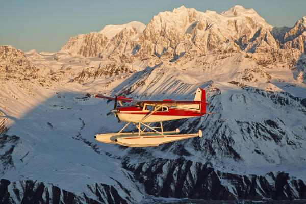 View Of A Cessna 185 Floatplane In Alaska Range Over Ruth Glacier At Sunset, Southcentral Alaska by PacificStock