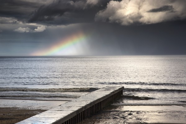 A rainbow shining in the storm clouds;Blyth northumberland england by PacificStock