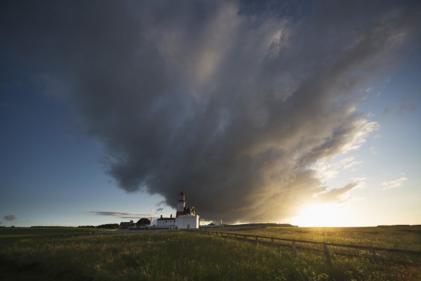 Souter lighthouse with a cloud formation above it at sunrise;South shields tyne and wear england by PacificStock