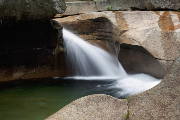 New England, New Hampshire, White Mountains, A forest riverbed and waterfall. by PacificStock
