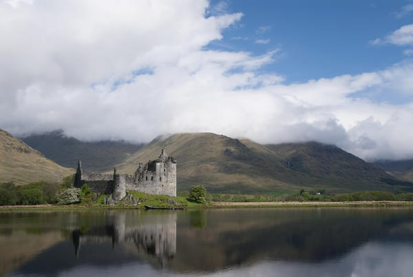 United Kingdom, Scotland, Kilcurn Castle on a peninsula at the end of Loch Awe, Castle reflecting in water. by PacificStock
