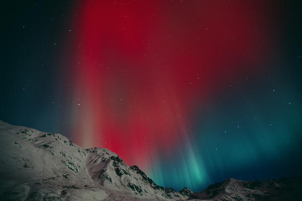 Red Aurora Over Talkeetna Mountains At Hatcher Pass In Southcentral, Alaska by PacificStock