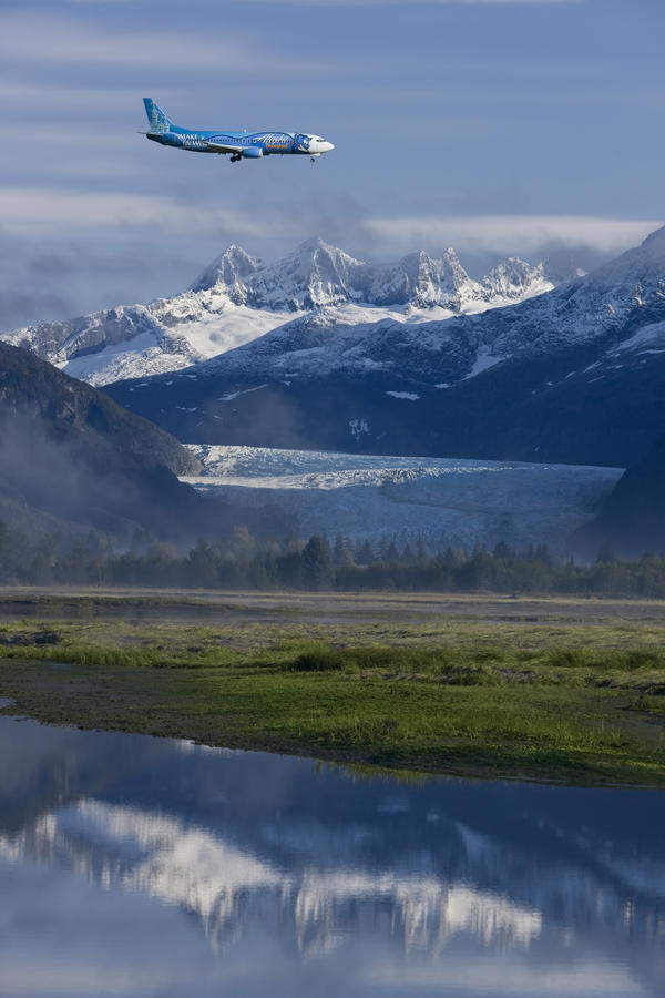 Alaska Airlines *Disney* Jet Approaches For A Landing At The Juneau International Airport With Mendenhall Glacier And Towers In The Background by PacificStock