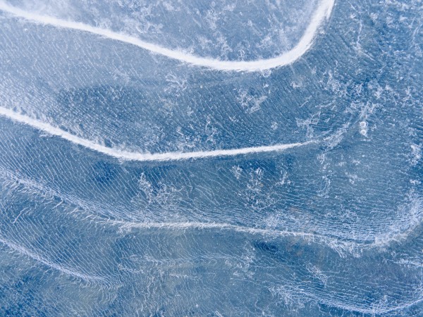 Abstract Patterns In The Ice During Winter Along The Tony Knowles Coastal Trail, Anchorage, Southcentral Alaska by PacificStock