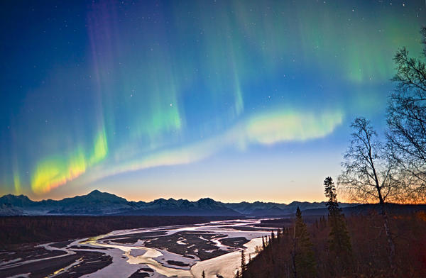 View Of Northern Lights In The Sky Above Southside Mount Mckinley And The Alaska Range At Twilight, Chulitna River In The Foreground, Denali State Park, Southcentral Alaska, Spring by PacificStock
