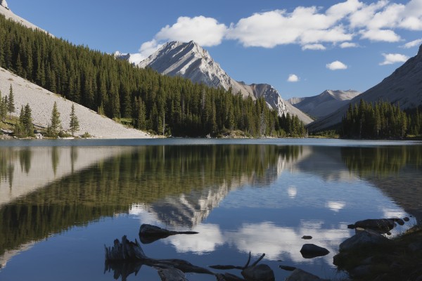 Mountain reflecting in lake with blue sky and clouds in kananaskis provincial park;Alberta canada by PacificStock