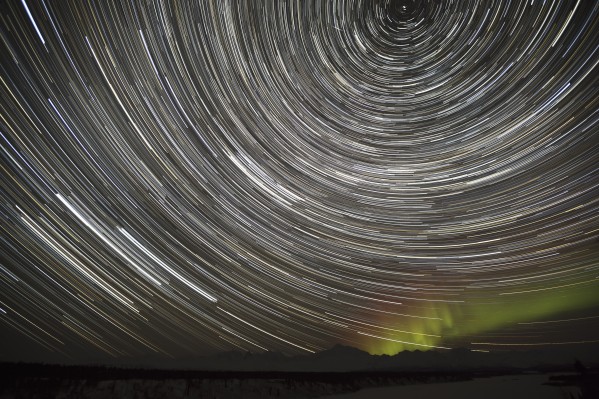 Star Trails and Northern Lights above Denali (Mt. McKinley) and the Alaska Range from Denali Viewpoint South along the Parks Highway, Denali State Park, Southcentral, Alaska, Winter by PacificStock
