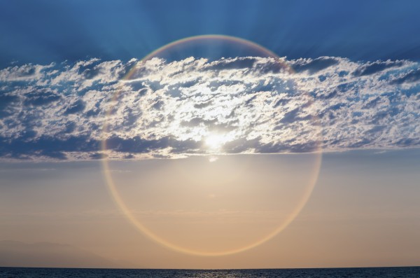 The setting sun creates a sundog;Puerta vallarta mexico by PacificStock