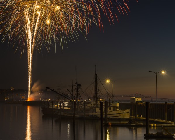 The annual July fourth fireworks brighten the Astoria sky; Astoria, Oregon, United States of America by PacificStock