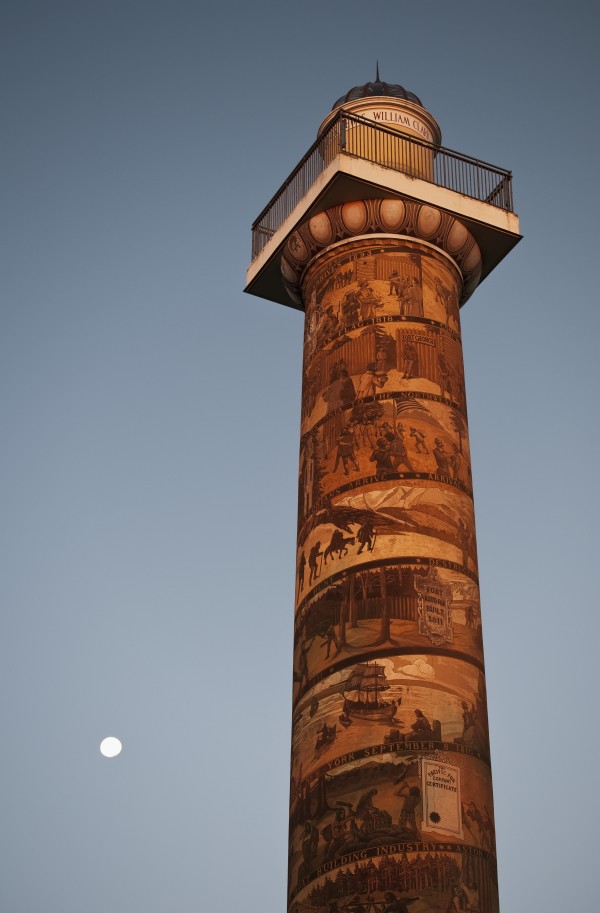The moon rises near the Astoria Column; Astoria, Oregon, United States of America by PacificStock