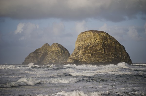 Waves break near Three Arch Rocks; Oceanside, Oregon, United States of America by PacificStock