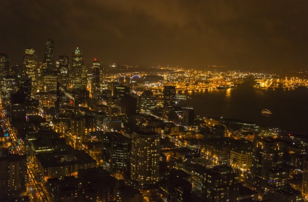 The lights of Seattle are viewed from the space needle at night; Seattle, Washington, United States of America by PacificStock