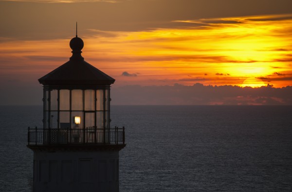 A sunset at North Head Lighthouse; Ilwaco, Washington, United States of America by PacificStock
