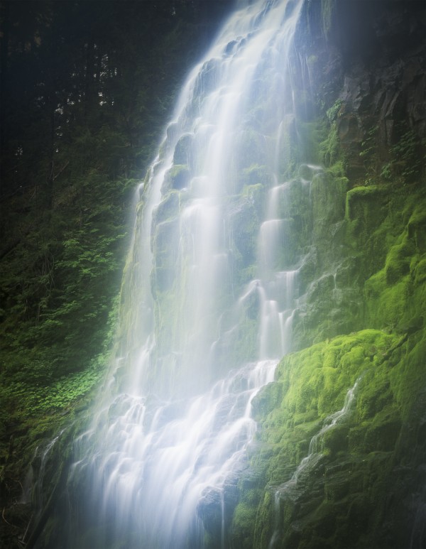 Water cascades down green moss covered rocks; Sisters, Oregon, United States of America by PacificStock