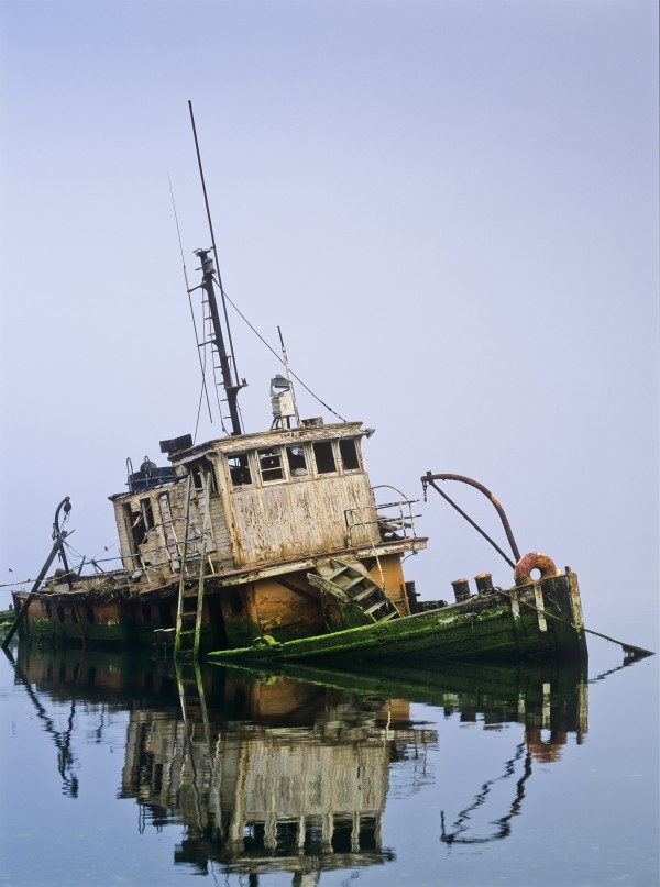 A derelict boat decays at Gold Beach; Oregon, United States of America by PacificStock