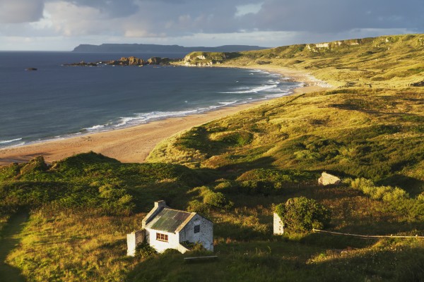 Cottage at White Bay; County Antrim, Ireland by PacificStock