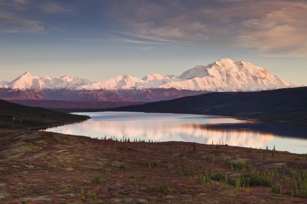 Alpenglow on Denali (Mt. McKinley) and the Alaska Range with Wonder Lake in foreground in Denali National Park and Preserve, Interior Alaska by PacificStock