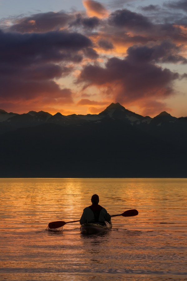 Sea Kayaking on a sublime evening in Lynn Canal near Eagle Beach State Recreation Area, Juneau. Alaska. Chilkat Mountains beyond in the distance. by PacificStock