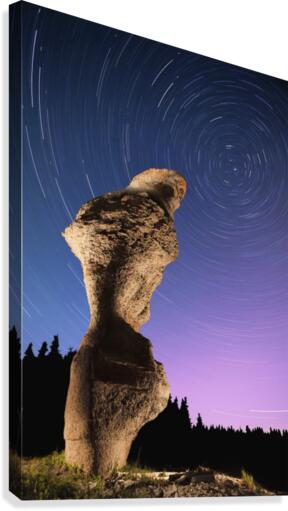 Light painting on monolith and star trails, Anse des Bonnes Femmes at Ile Niapiskau, Mingan Archipelago National Park Reserve of Canada, Cote-Nord, Duplessis region; Quebec, Canada Canvas Print