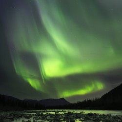 A bright aurora engulfs the Northern skies over Portage River; Alaska, United States of America
