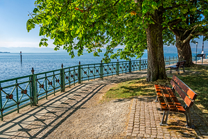 Bench at idyllic promenade in Friedrichshafen at Lake Constance in Southern Germany 