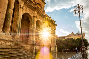 Sun shining through beautiful baroque building in Noto Sicily Italy