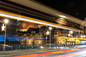 Night shot of blurred car lights in front of the historic oldtown of Tübingen