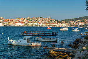 Beautiful rugged coastline and boats near Mali on the island of Losinj in the Adriatic Sea Croatia