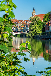 Riverside view of the old town and church of Tübingen in Germany in summer