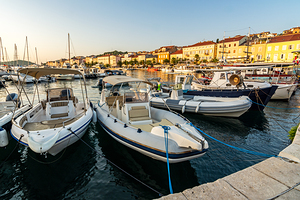 Boats at sunset in the marina of Mali on the island of Losinj in the Adriatic Sea Croatia