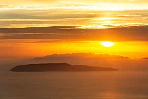 Island of Favignana in front of Trapani on Sicily during dramatic colourful sunset 